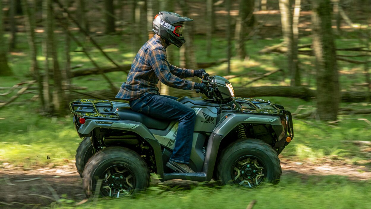 Right angle of rider on Rubicon in woods.