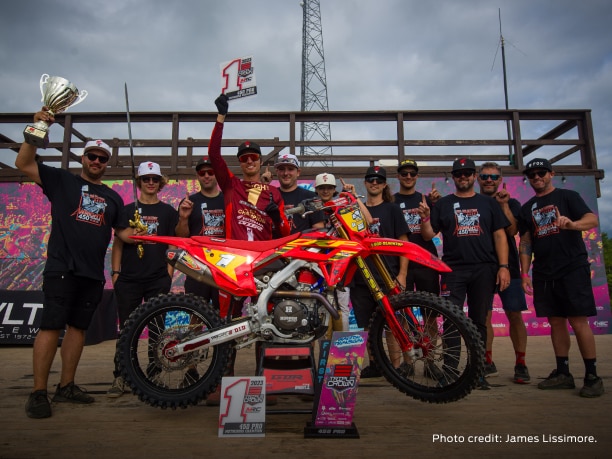 The Honda racing team behind a Competition dirt bike 