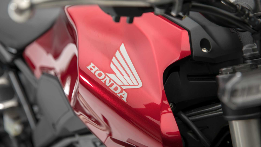 A Honda logo on the side of a motorcycle 