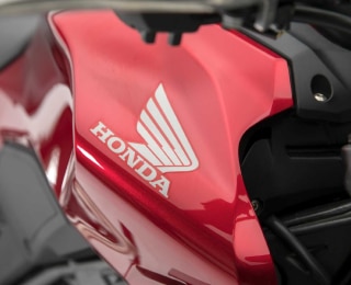 A Honda logo on the side of a motorcycle 