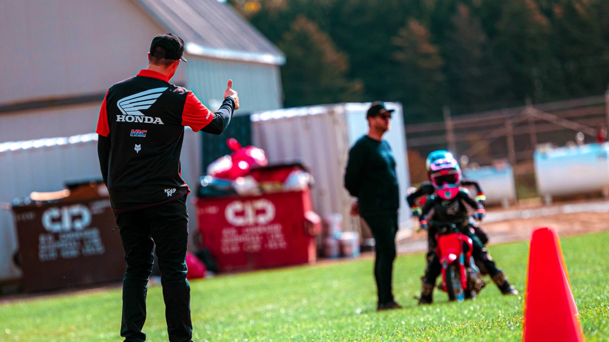Instructor giving a Junior Red Rider a thumbs up signal