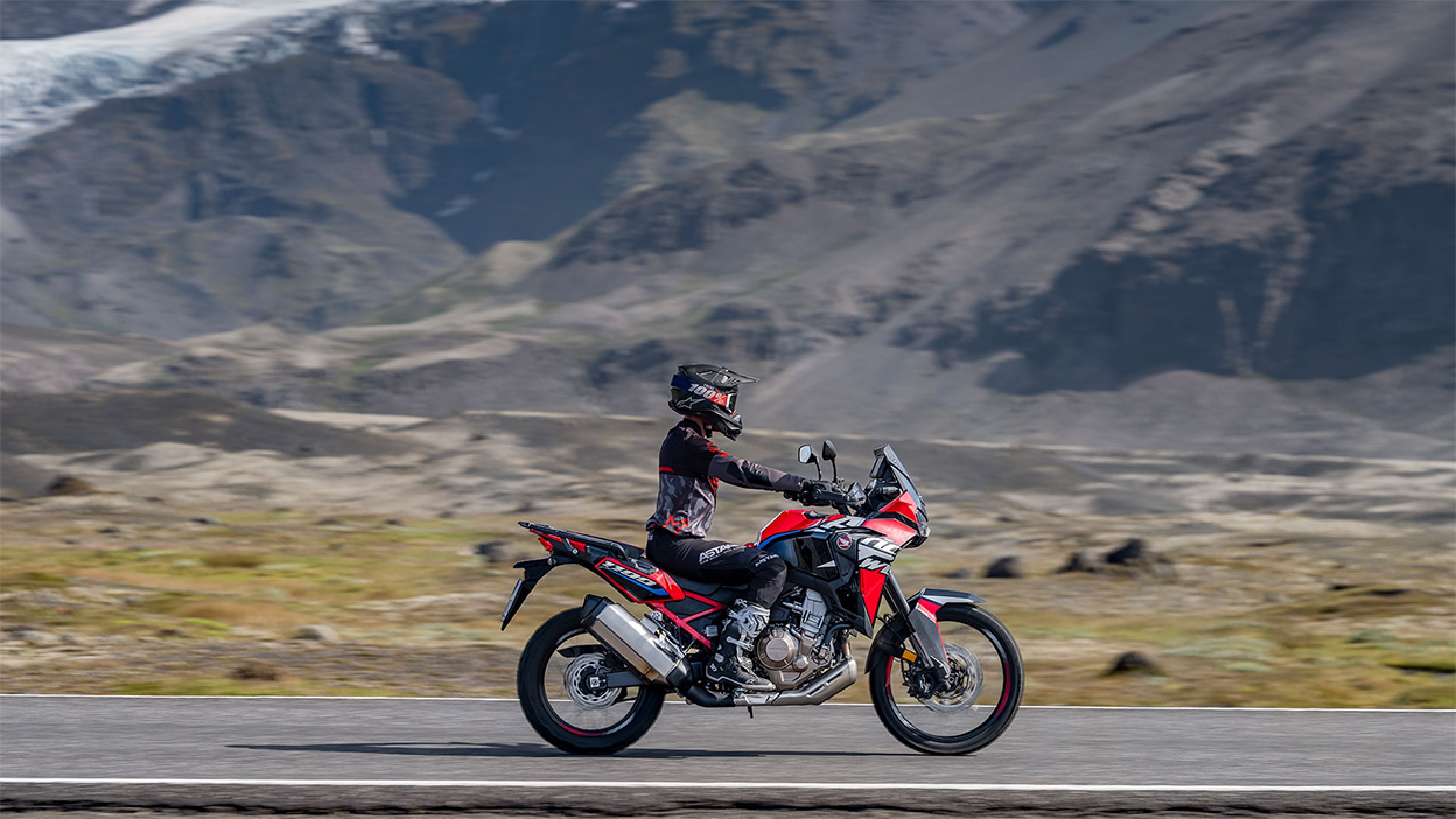 A rider on an Africa Twin the mountains 