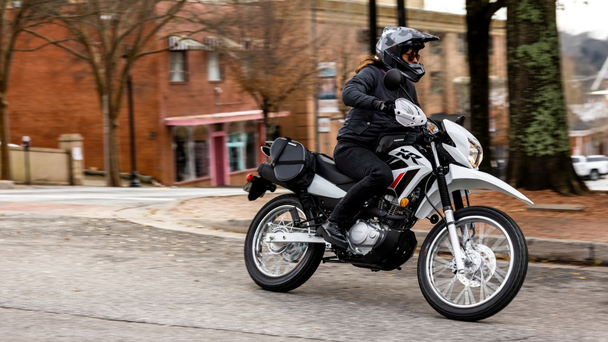 A rider in the city on a Honda XR150L