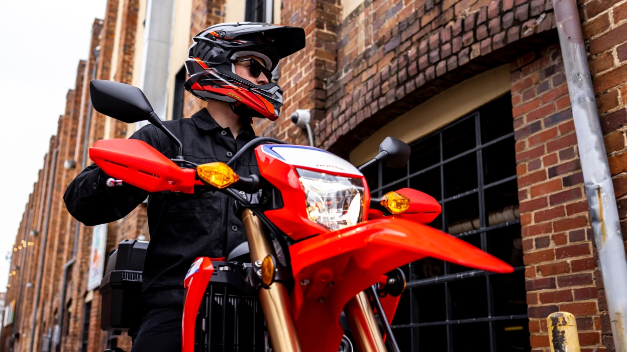 A rider in the city on a Honda Dual Sport