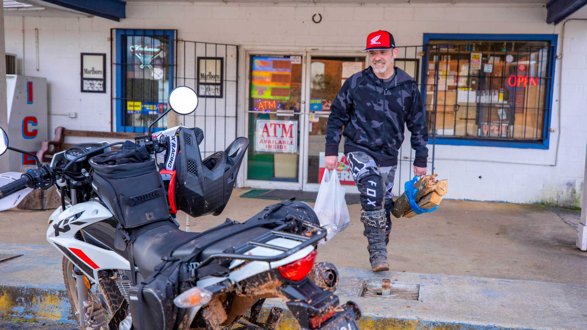 A rider getting groceries a Honda XR150L