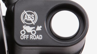 A close-up of the Honda CRF300L ABS switch