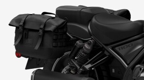 Close up of additional luggage attached to rear of bike. 