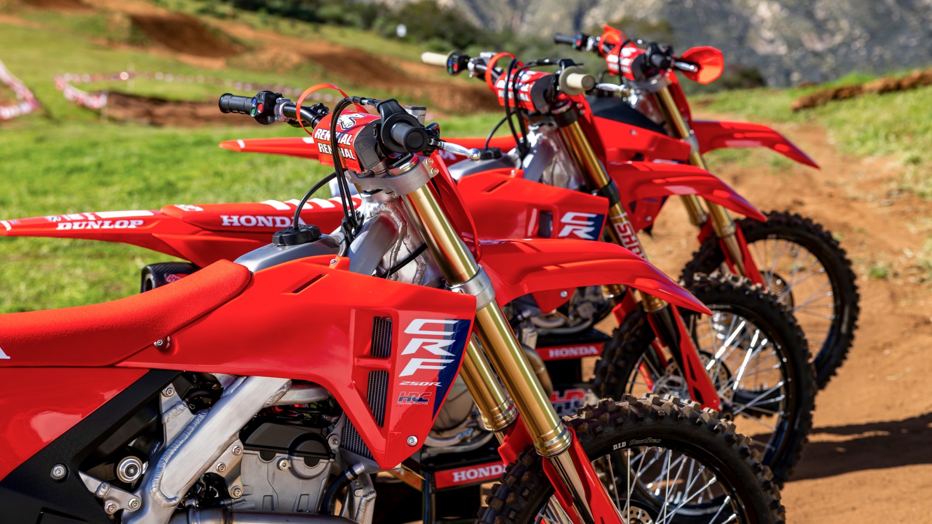 Close up of top of motorbikes facing right.