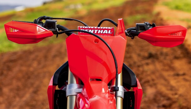 The hand guards on the handelbars of a Honda CRF450RX