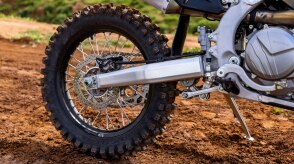 The back tire of a parked Honda CRF450RX