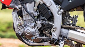 An up close engine of a Honda CRF450RX on a trail