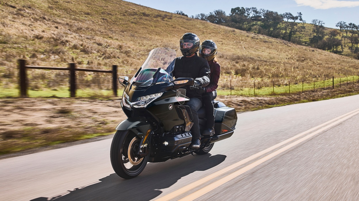 A touring motorcycle parked at a scenic overlook.