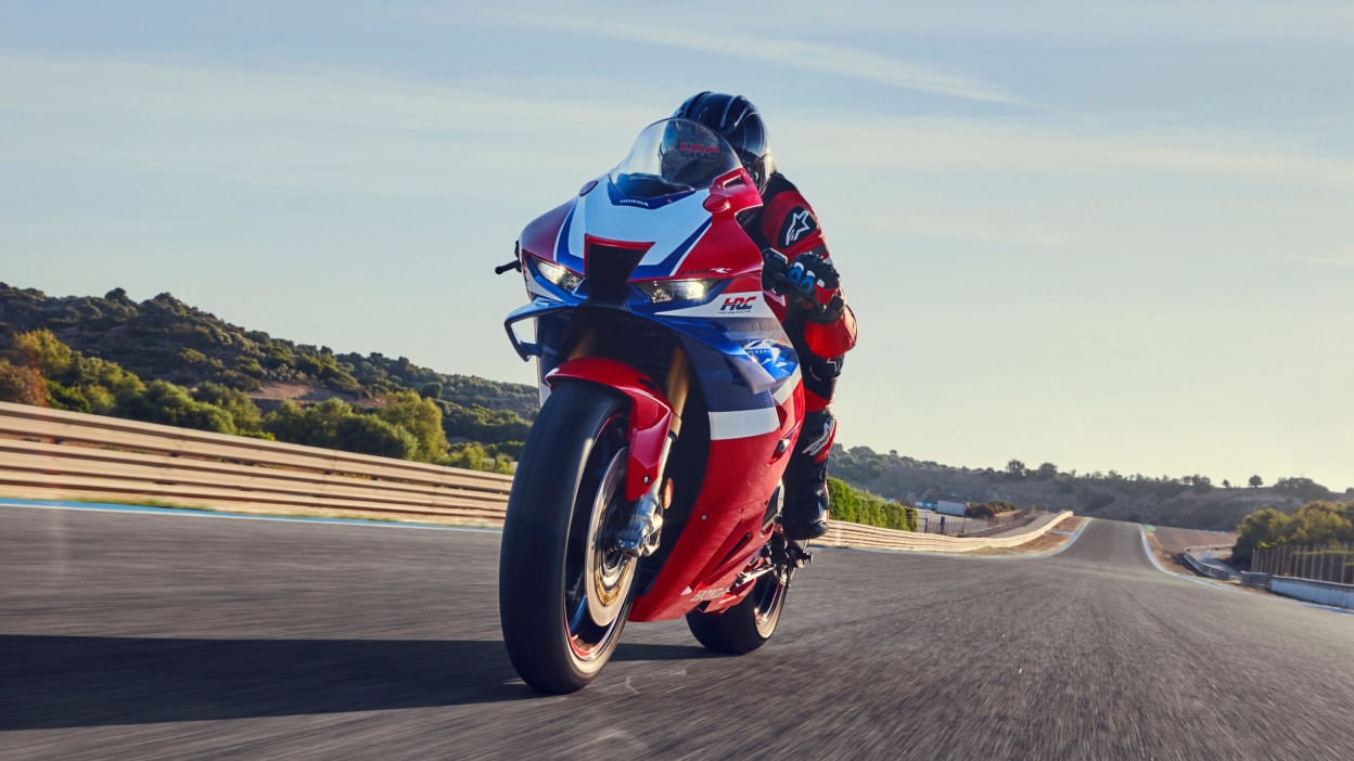 Birds eye view of rider on CBR1000RR-R Fireblade on race track.