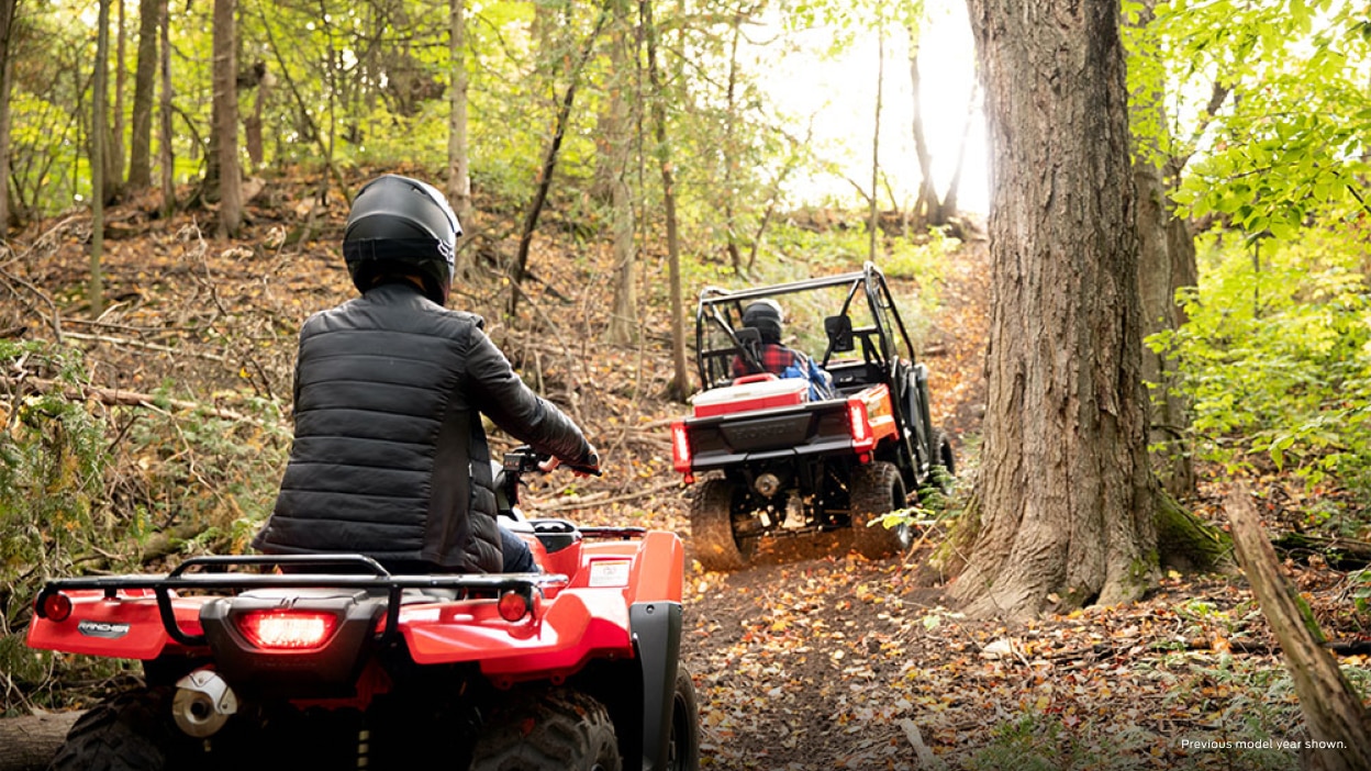 Riders in a Honda Pioneer 520 and a Honda ATV riding together