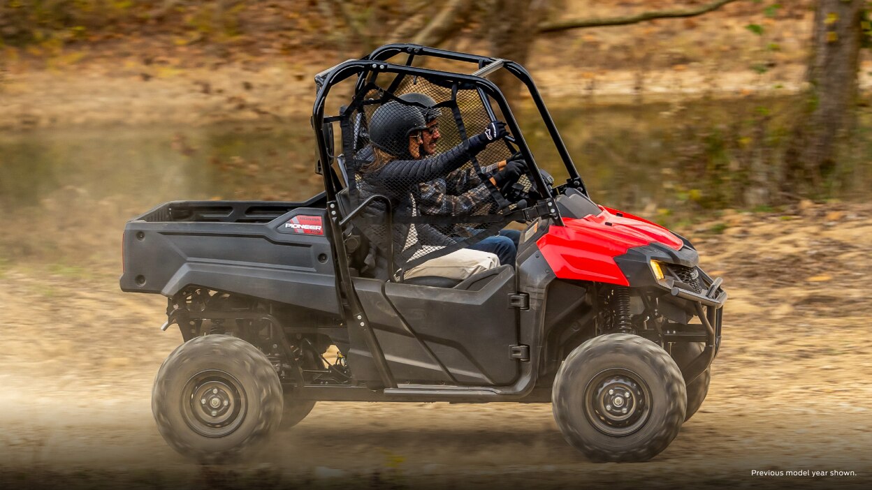 Lifestyle. Drivers on dirt road going right.