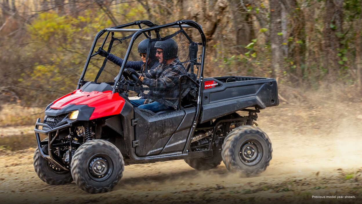 Lifestyle. Drivers on dirt road going left.